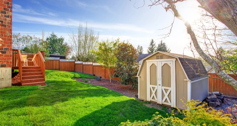 Fenced backyard with storage shed in Wausau